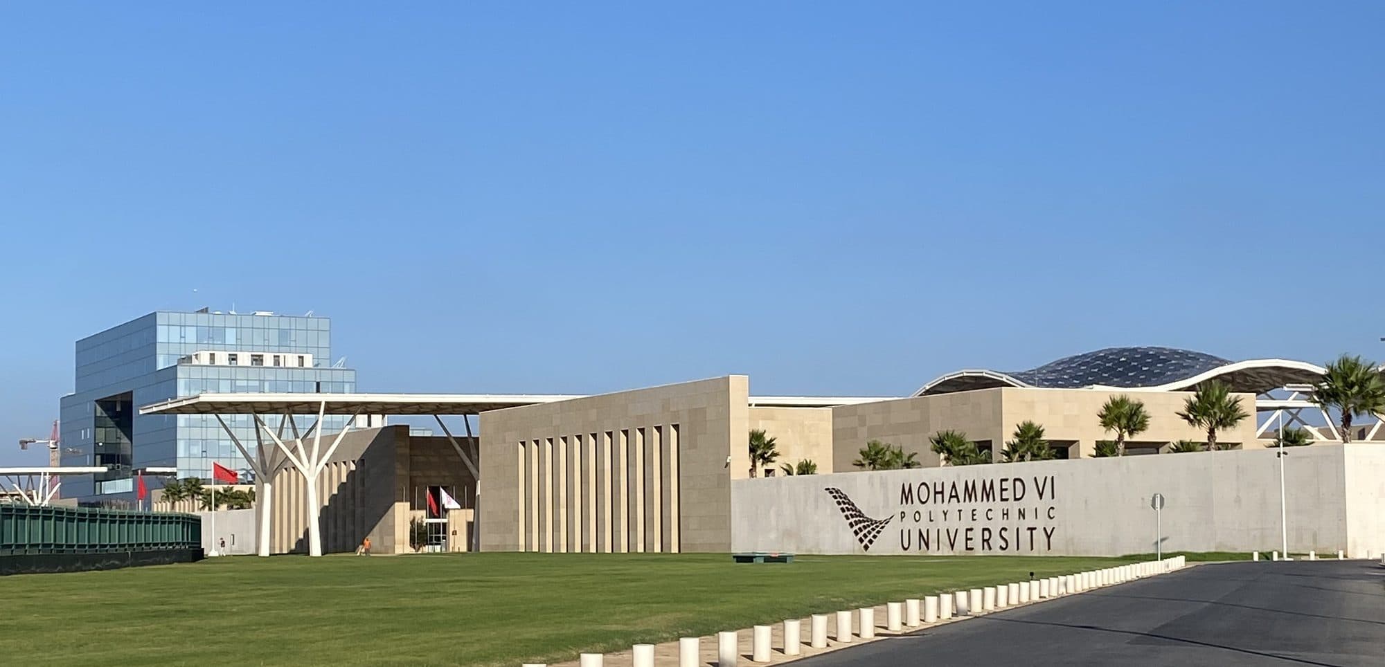 The campus of a modern university near Rabat under a clear blue sky